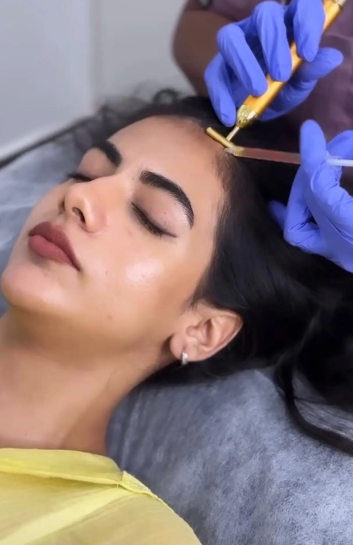 Trichologist performing a professional hair care consultation and scalp analysis